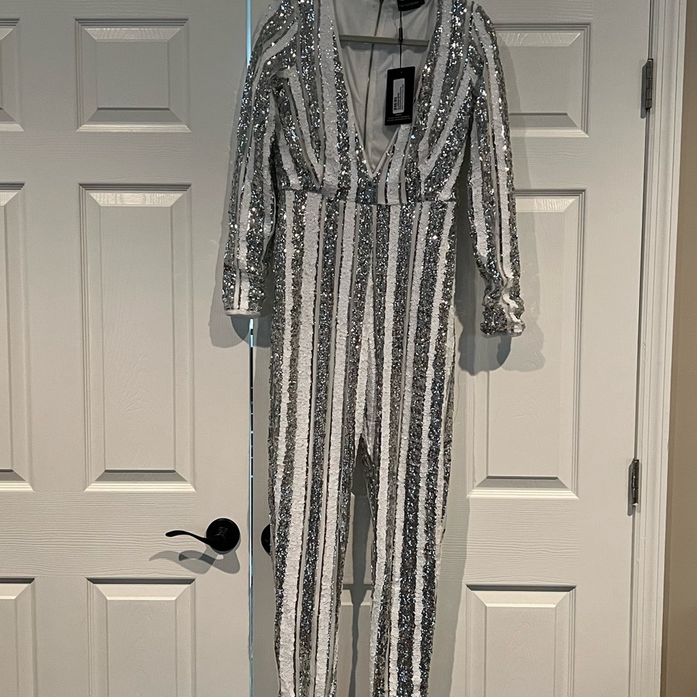 New very sexy sequins low cut jumpsuit. Never worn